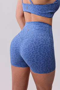 Blue leopard print activewear set with high-waisted shorts and sports bra for workout or everyday wear