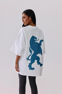 White oversized t-shirt with blue lion graphic, paired with black leggings for activewear style