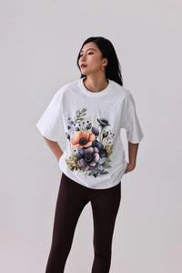 White floral print activewear tee with dark leggings, perfect for yoga or casual wear