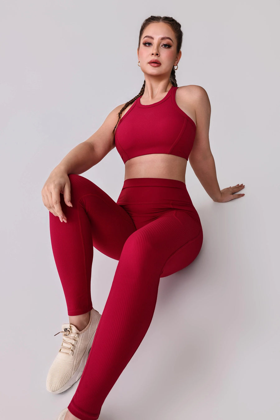 Red ribbed activewear set with high-waisted leggings and sports bra for performance and comfort
