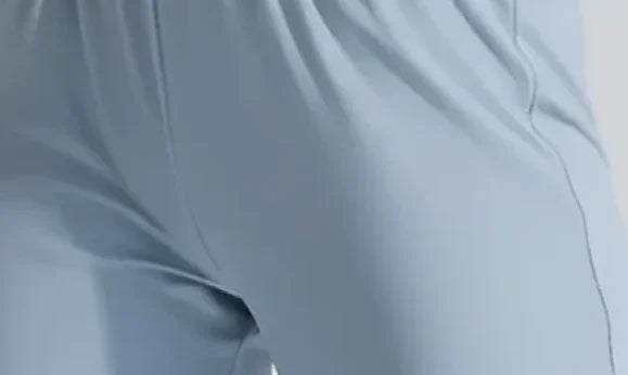 Light blue seamless leggings with smooth fabric and side seam detail, ideal for activewear and performance